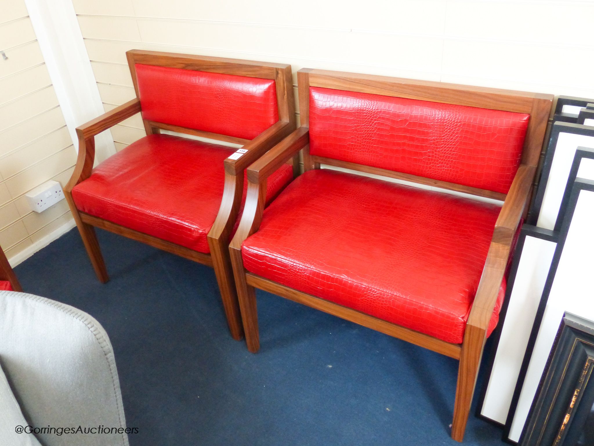 A pair of contemporary walnut and faux crocodile armchairs, 77cm wide